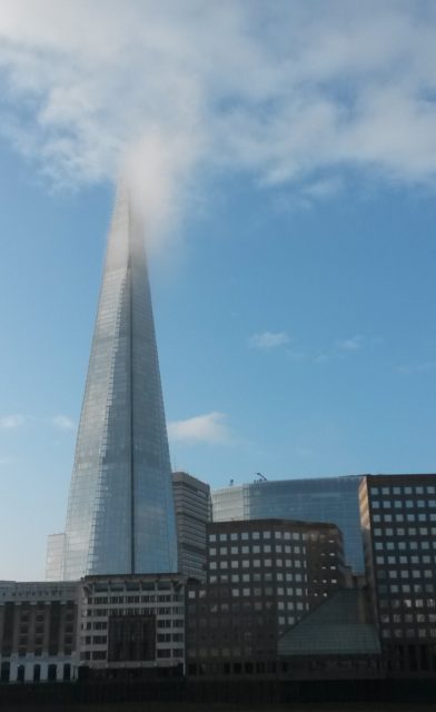 London Shard with clear blue sky though a little mist hanging around at the top of it