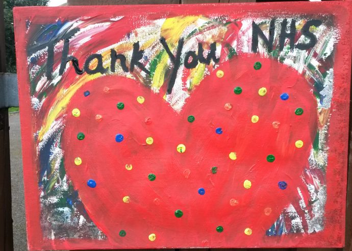 A child's painting with a big red heart saying 'Thank you NHS'