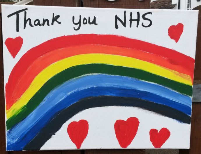 A child's painting of a rainbow with Thank you NHS written at the top