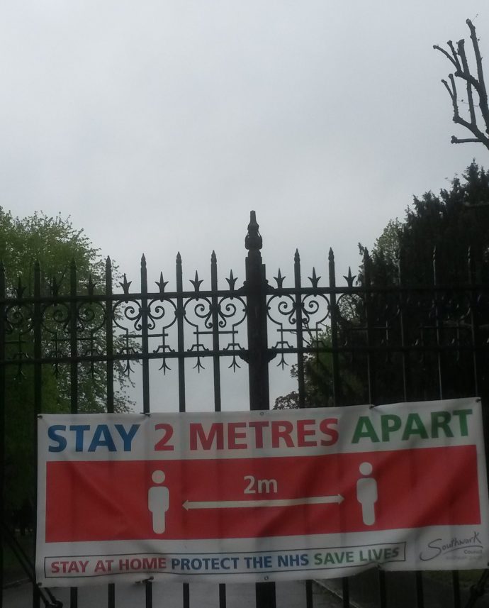 2 metres apart sign on gates at Dulwich Park