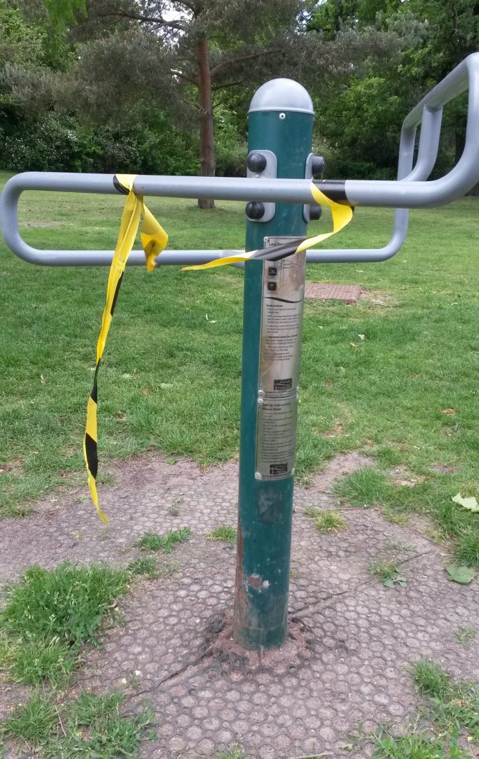 Broken tape on park gym equipment