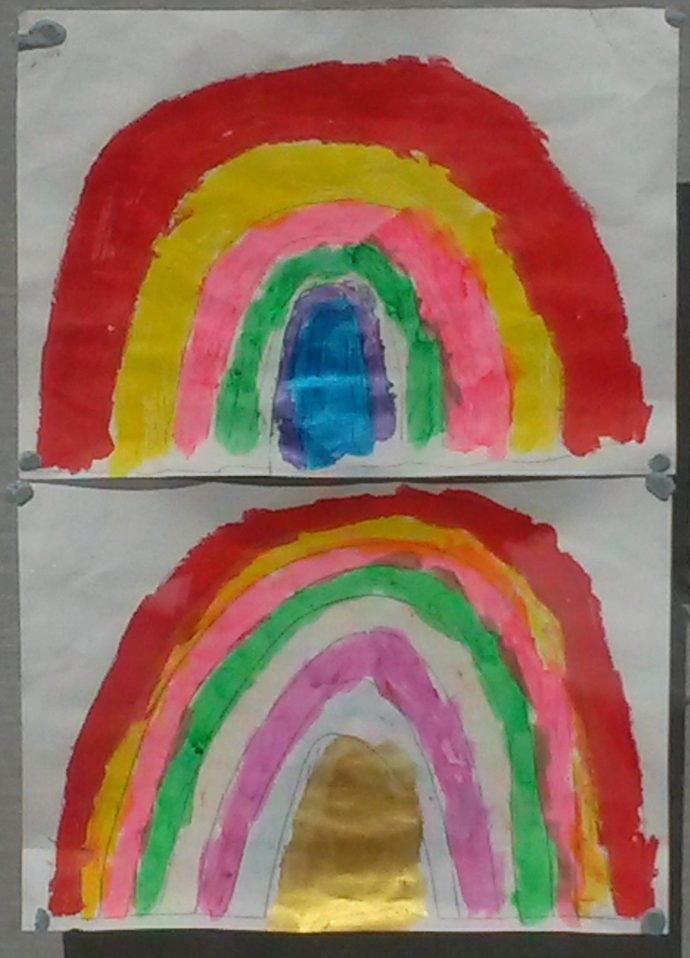 Day 59 of lockdown - two rainbow drawings in a windo