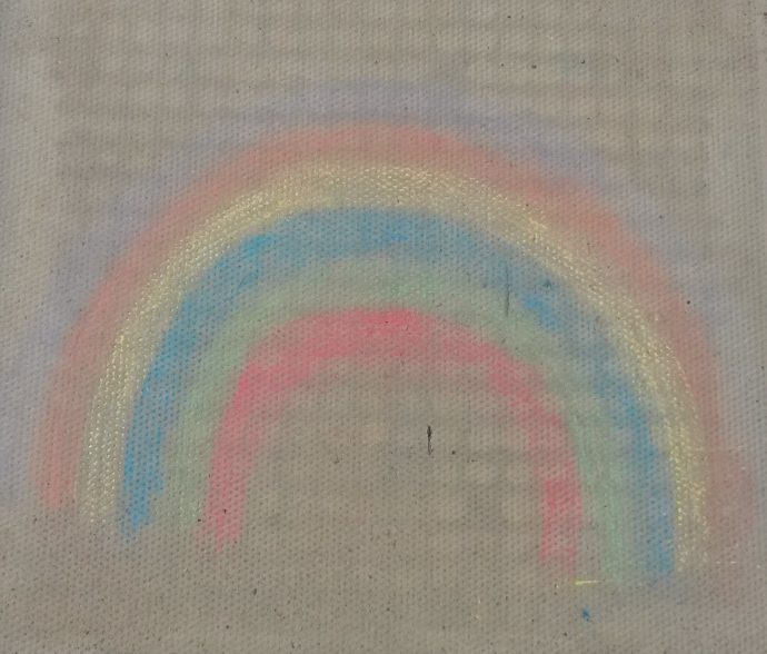 Day 56 of lockdown - faded rainbow in crayon on local footpath