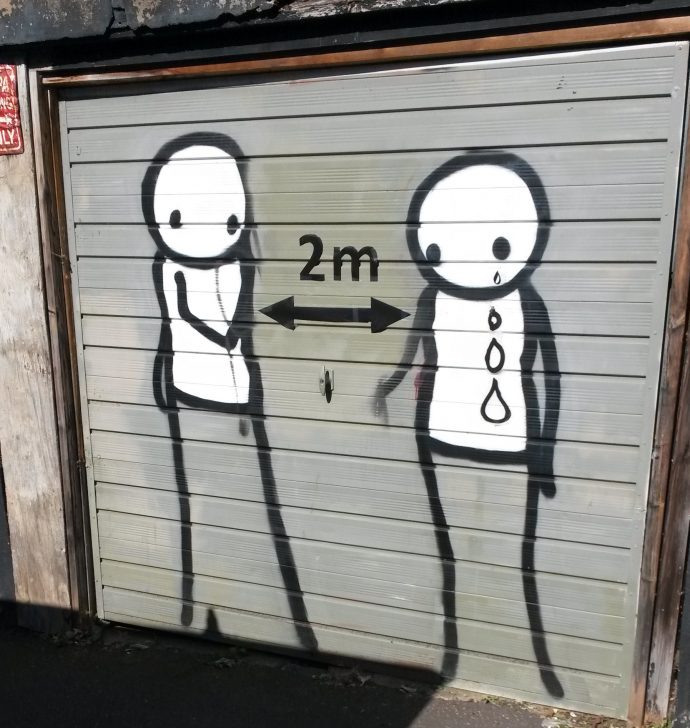 East Dulwich Street Art - 2 people, thankfully 2m apart and tears and stuck on and not permanent