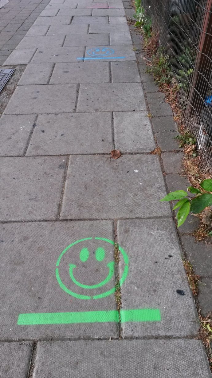 entrance to childcare with smiley face markers